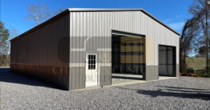 40’x60’x14’ custom steel building with a large roll-up door, walk-in door, and open interior space.