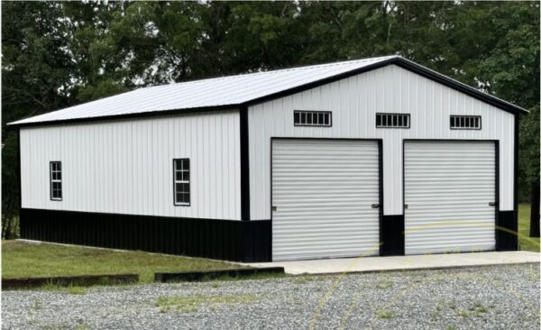 24x40x12 custom steel building with two 10’x10’ roll-up doors, four 24”x36” windows, three 12”x36” transom windows, and a 36”x80” walk-in door.